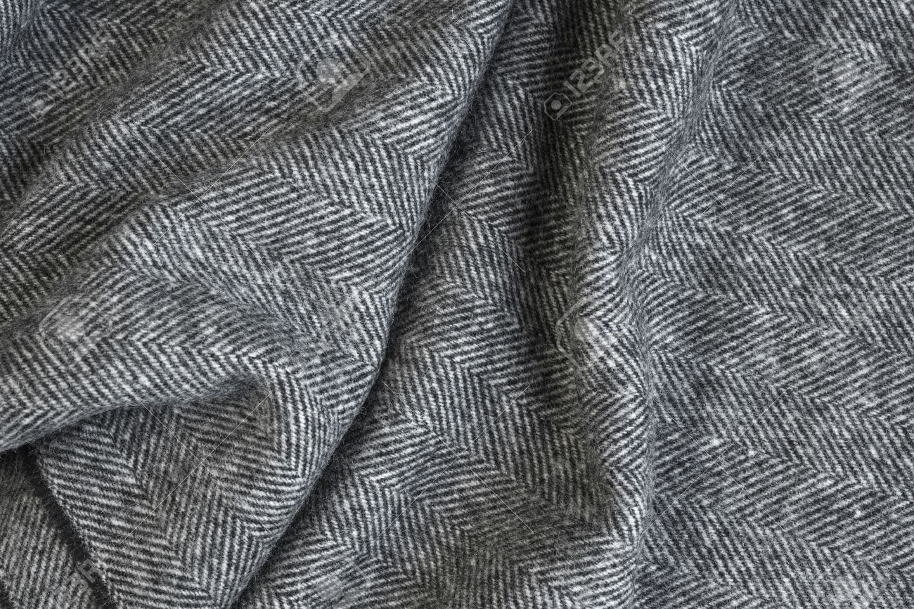 45327264-draped-herringbone-tweed-background-with-closeup-on-wool-fabric-texture